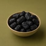 Ajwa Al-Madinah dates in a bowl