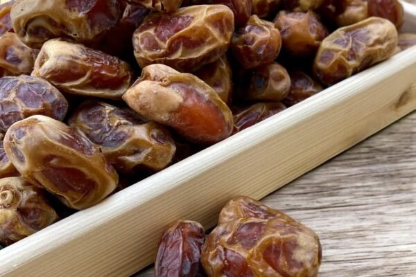 Sugai dates on a wooden tray
